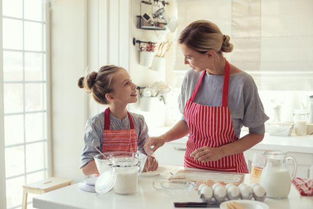 44715931 - mom with her 9 years old daughter are cooking in the kitchen to mothers day, lifestyle photo series in bright home interior