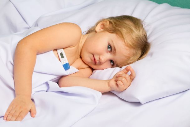 49533710 - sick little girl in bed.virus, flu, cold, fever.